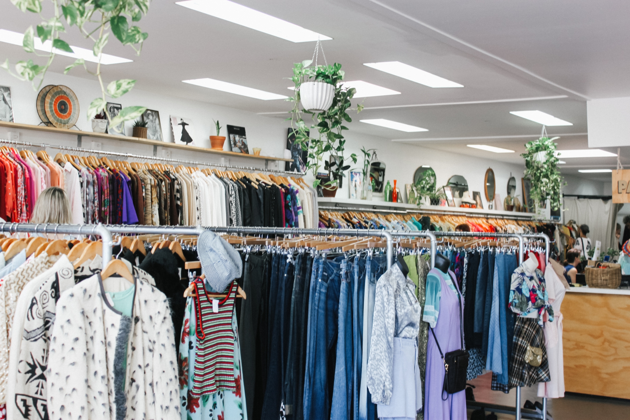 Assorted Color Clothes Hanged Inside Department Store With Lights Turned On