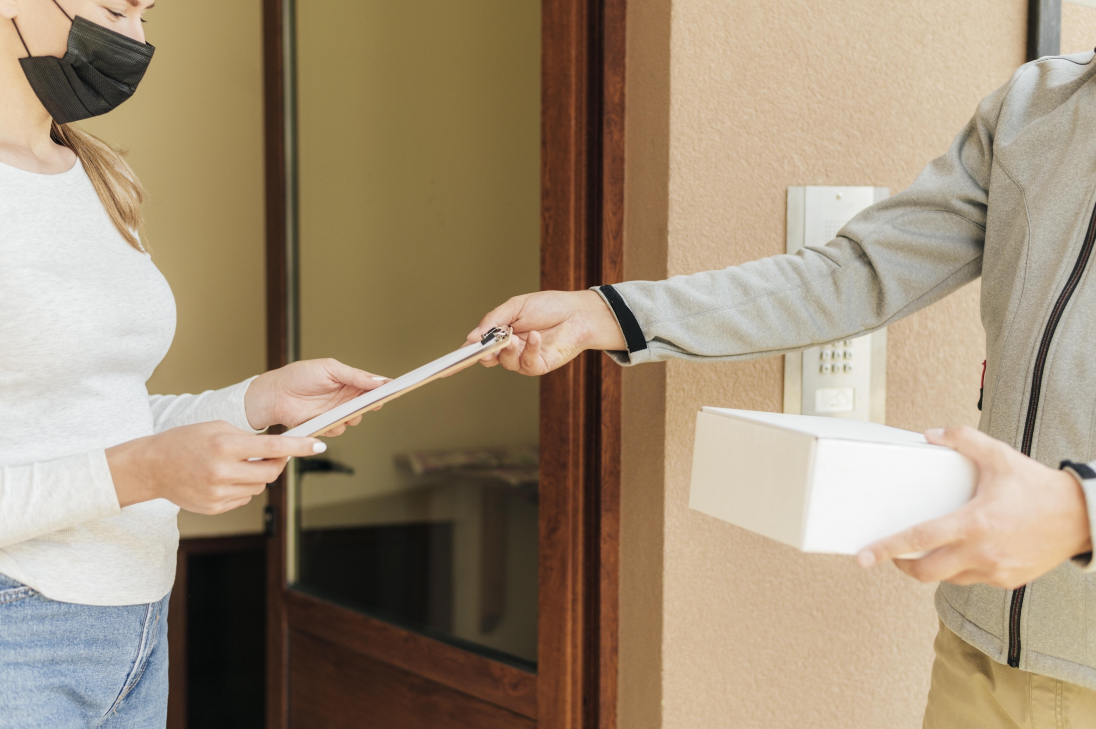 Close Up Hands Delivering Package